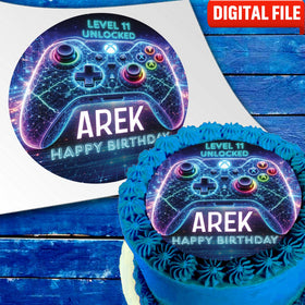 Neon gamer cake topper with glowing game controller and name on blue birthday cake