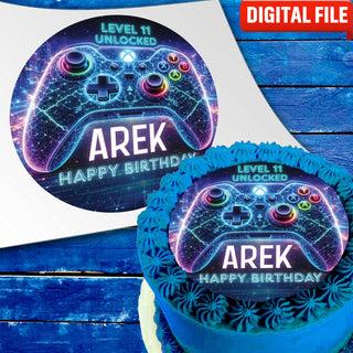 Neon gamer cake topper with glowing game controller and name on blue birthday cake