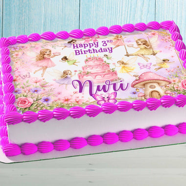 Fairy birthday cake topper with name on pink girls birthday cake