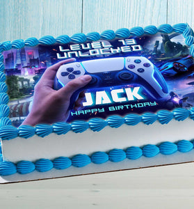Gaming birthday cake with edible topper featuring game controller, level unlocked design and personalized name