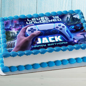 Gaming birthday cake with edible topper featuring game controller, level unlocked design and personalized name