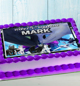 Dragon-themed birthday cake with colorful edible topper for kids party