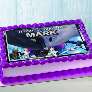 Dragon-themed birthday cake with colorful edible topper for kids party