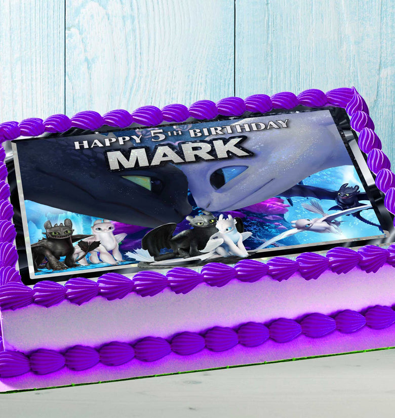 Dragon-themed birthday cake with colorful edible topper for kids party