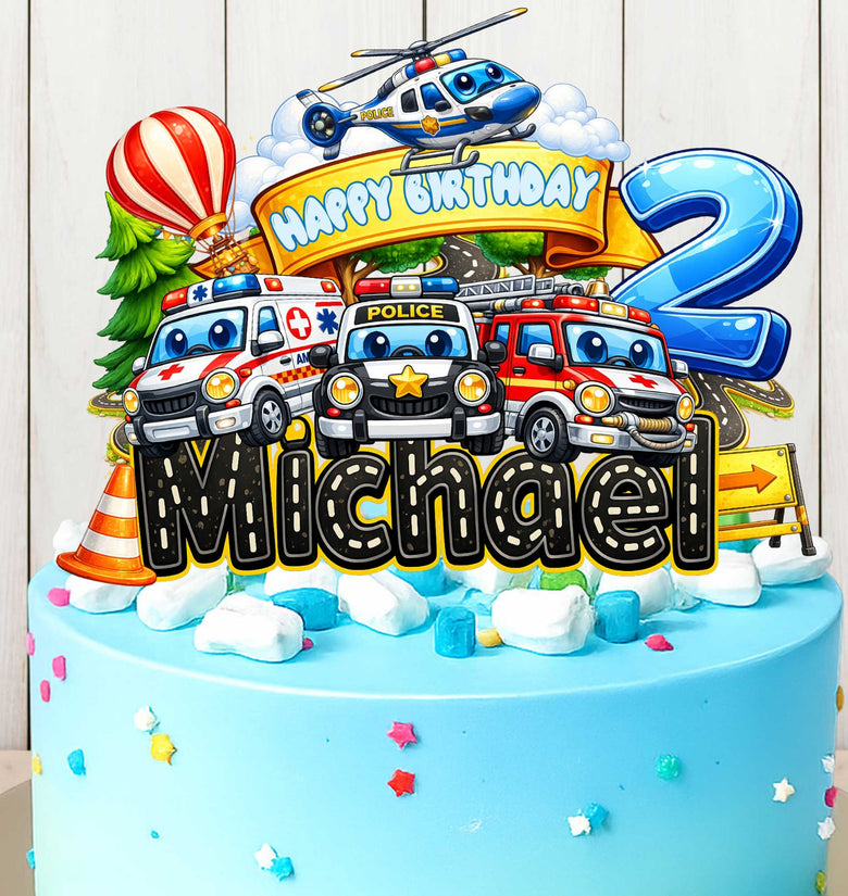 Kids vehicles birthday cake topper on cake with police car, fire truck, ambulance and helicopter, personalized with name and age