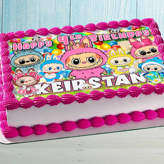 Birthday cake with colorful cute monster topper design and child's name in bright colors