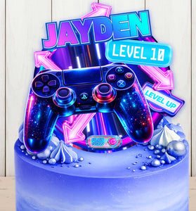 Gaming cake topper mockup on blue birthday cake, level up design with neon game controller