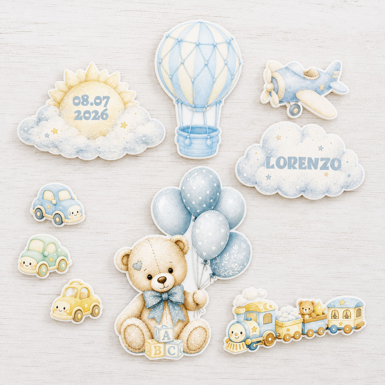Teddy bear travel edible topper set flat lay with balloon, airplane and train pieces