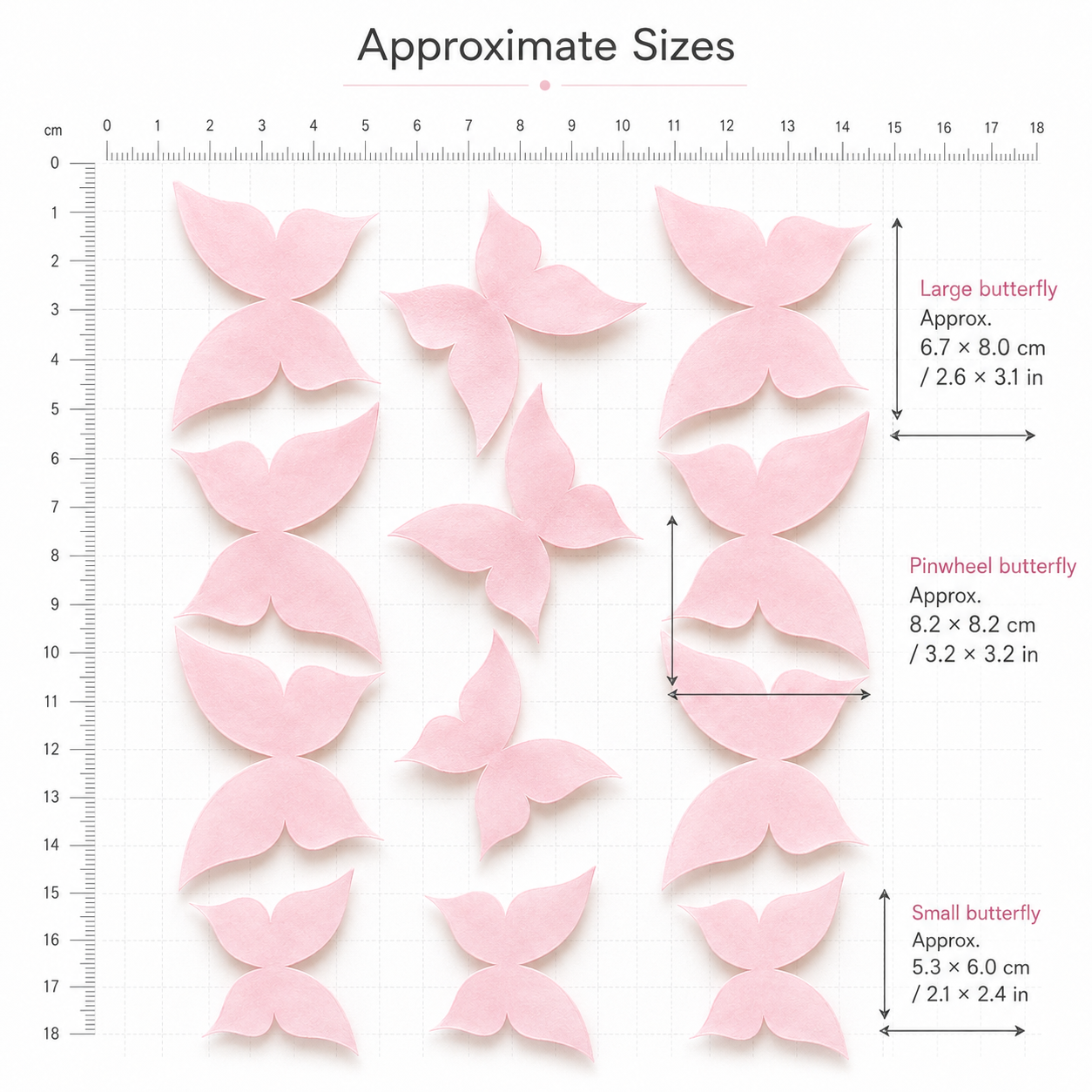 Pink wafer paper butterfly size guide with ruler showing large 6.7x8cm, pinwheel 8.2x8.2cm and small 5.3x6cm