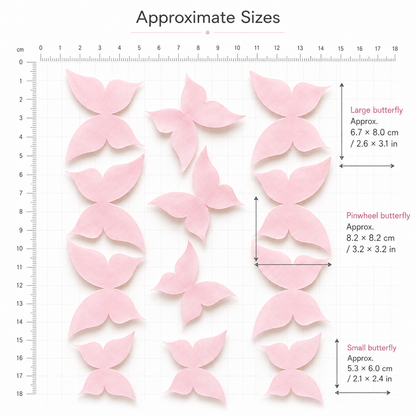 Pink wafer paper butterfly size guide with ruler showing large 6.7x8cm, pinwheel 8.2x8.2cm and small 5.3x6cm