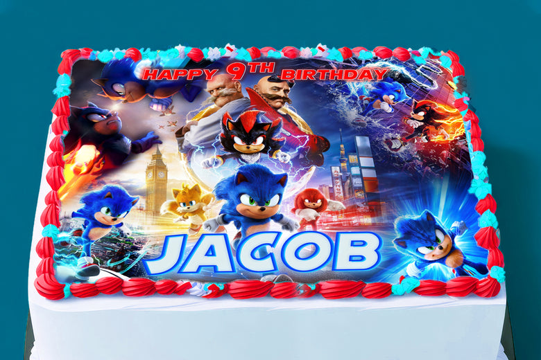 Sonic themed edible cake topper on a birthday cake with bright blue border frosting