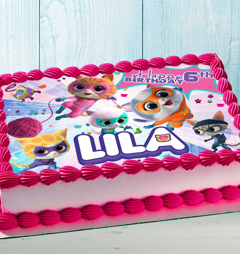 Kids birthday cake with colorful cute kittens edible topper and bright pink frosting