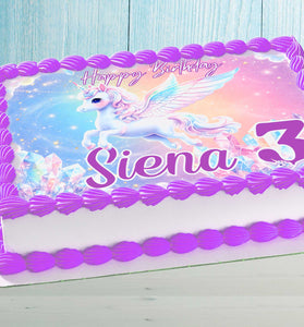 Unicorn birthday cake topper on rectangular cake with purple frosting border