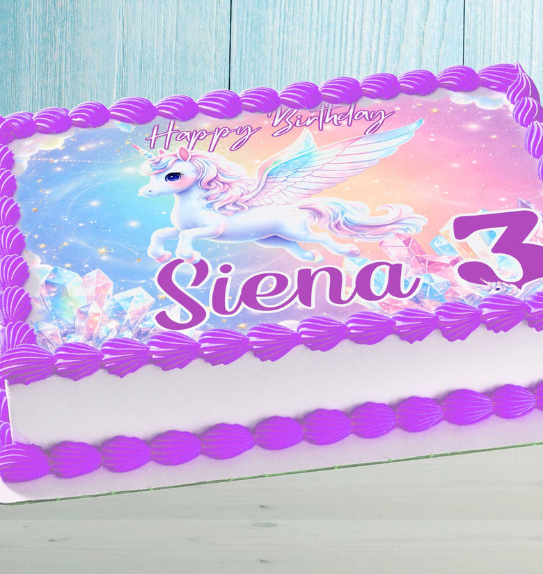 Unicorn birthday cake topper on rectangular cake with purple frosting border