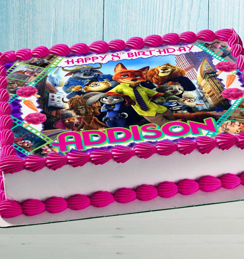 Zootopia birthday cake topper with name and age on a rectangular cake, colorful edible image for kids party