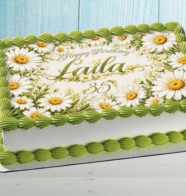 Personalized daisy edible cake topper with custom name on birthday cake floral decoration