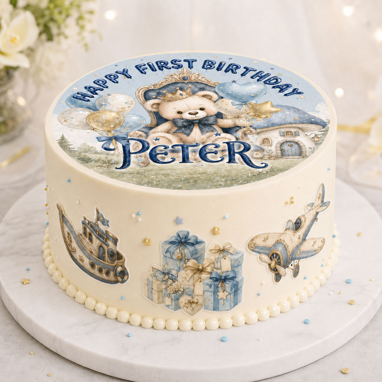 First birthday teddy bear prince edible topper set displayed on a round birthday cake