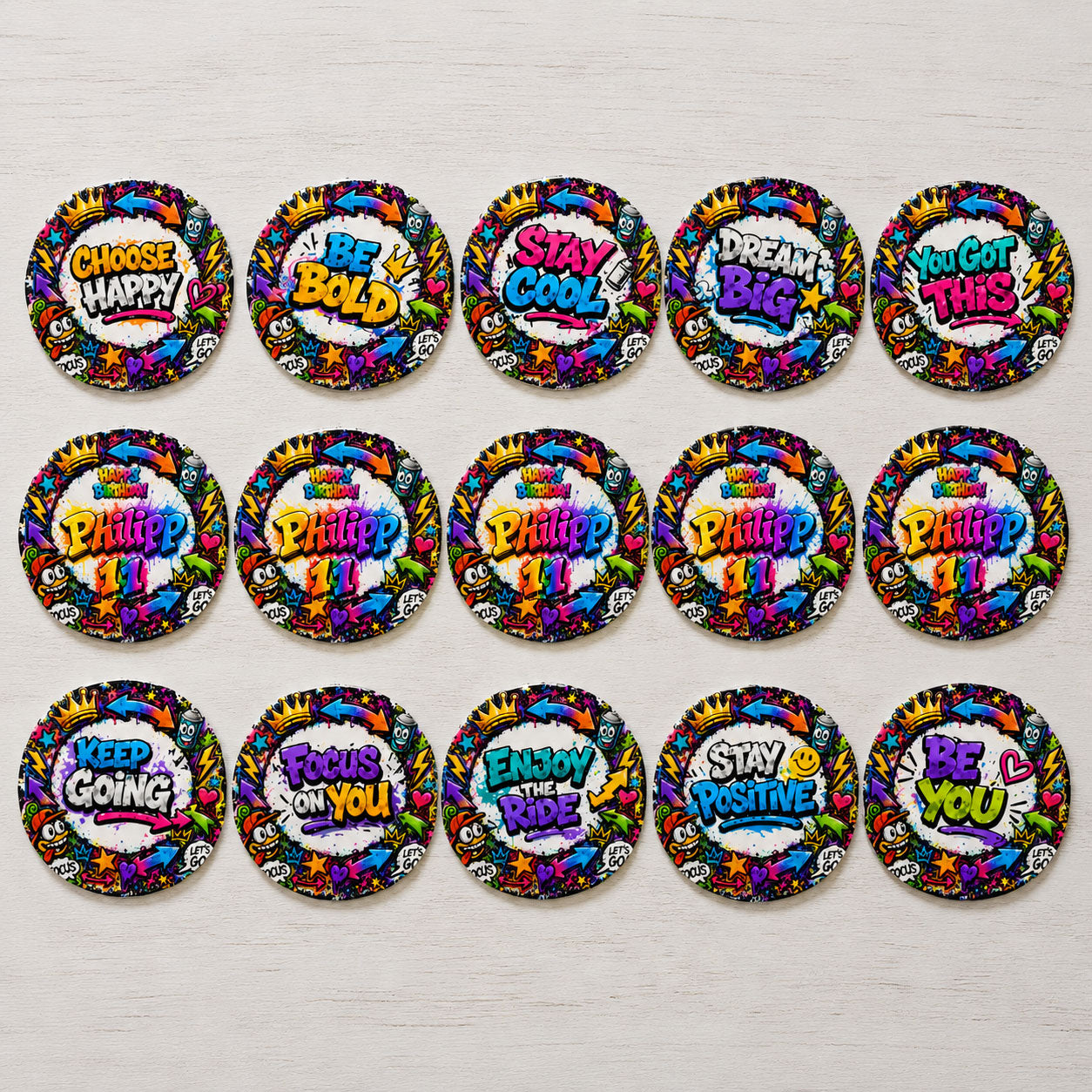 Graffiti style edible cupcake toppers flat lay with colorful street-art motivational text designs