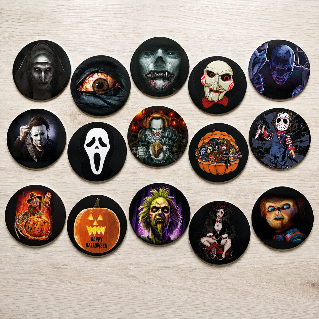 Horror movie themed edible cake toppers flat lay with classic slasher and supernatural fan art designs