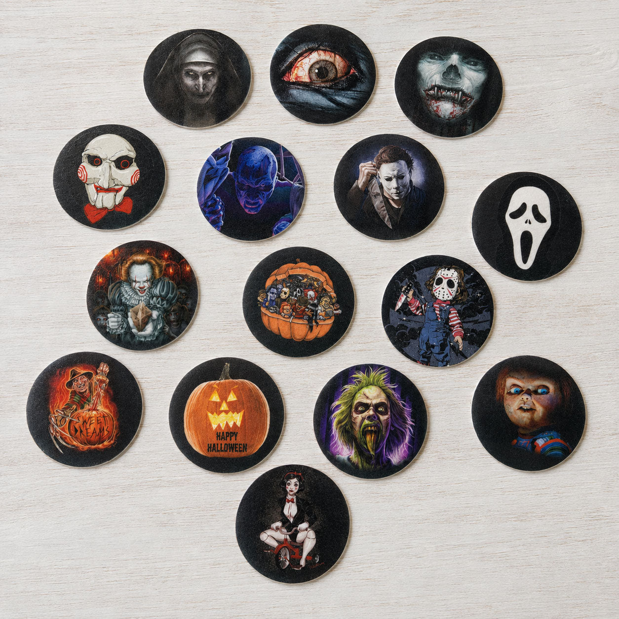 Horror movie themed edible cake toppers in a scattered arrangement featuring classic horror character illustrations