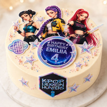 K-Pop idol group edible cake topper scene on a frosted cake with personalized birthday name and stars