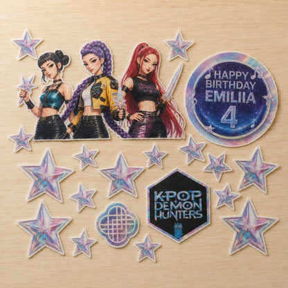 K-Pop idol group edible cake topper pieces flat lay with personalized birthday circle and star accents