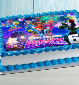 Close-up of Super Mario Galaxy edible cake topper applied to rectangular birthday cake